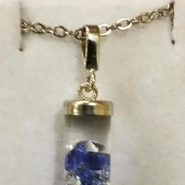 Tubular glass form with sapphire and zircon inclusions, 2018 archive photograph